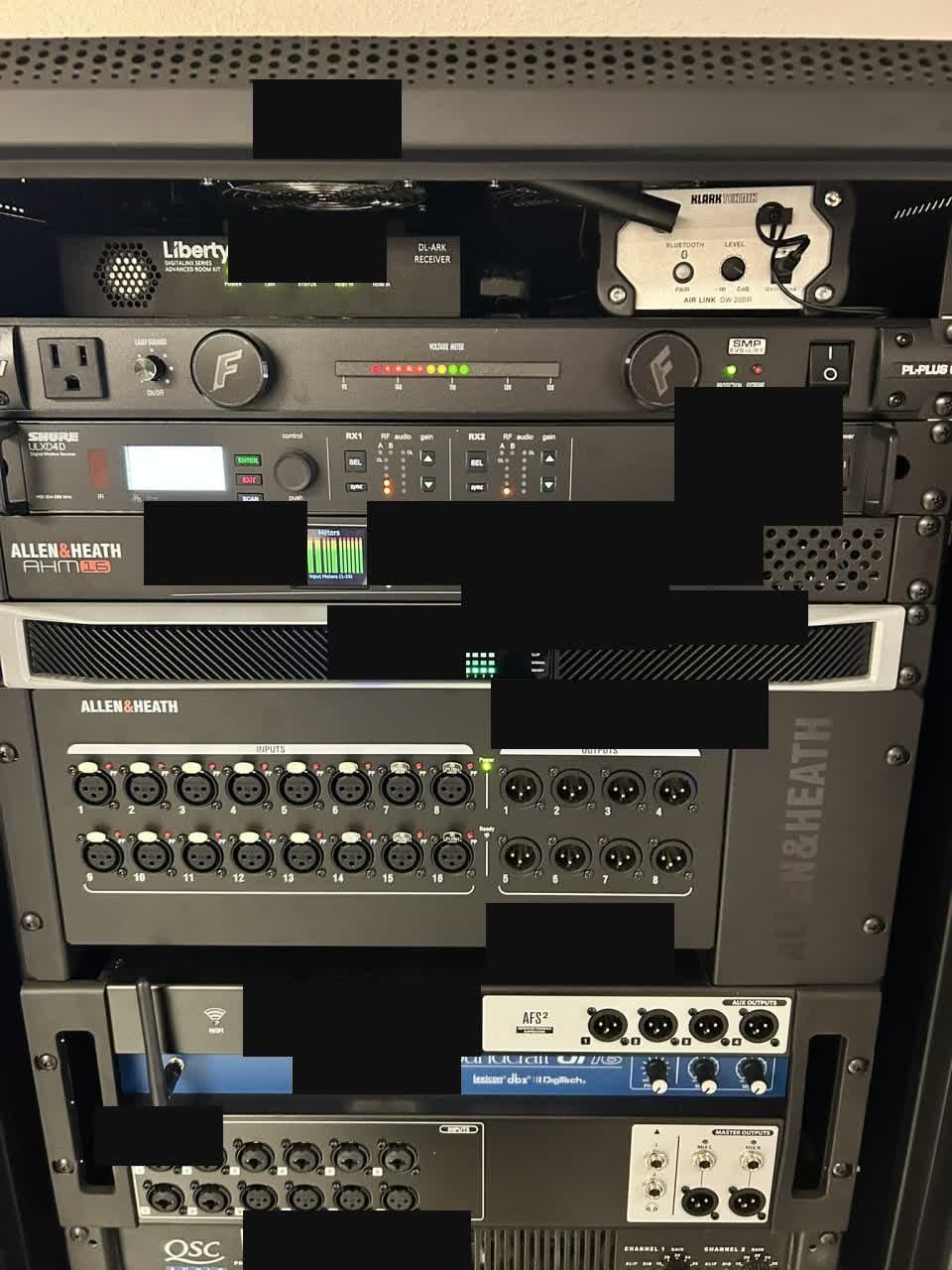 SLMS gym sound system rack with equalizer amplifier and wireless microphone receivers, sensitive labels redacted